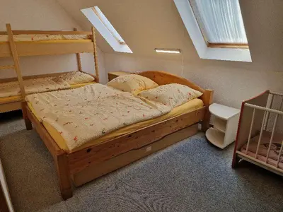 Ein Bett oder Betten in einem Zimmer der Unterkunft FEWO Torfhaus Holzhau