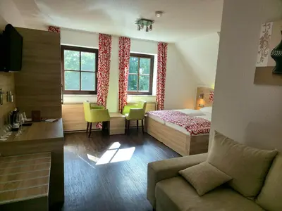 Ein Bett oder Betten in einem Zimmer der Unterkunft Berggasthof & Hotel Götzinger Höhe