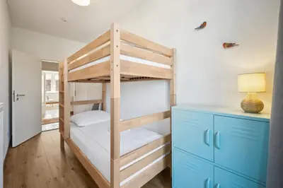 Ein Bett oder Betten in einem Zimmer der Unterkunft Großzügige Wohnung für Gruppen & Familien I Balkon