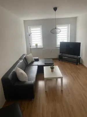 Ein Sitzbereich in der Unterkunft Ferienwohnung 2 am Holzwurm