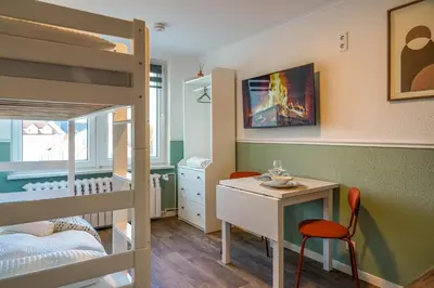 Ein Bett oder Betten in einem Zimmer der Unterkunft BaLa Suites Apartment House