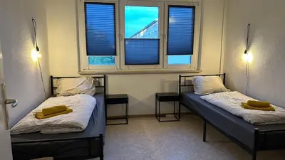 Ein Bett oder Betten in einem Zimmer der Unterkunft MiCasa TuCasa - 4-R-Apartment Leipziger Neuseenland Sirius