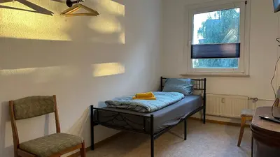 Ein Bett oder Betten in einem Zimmer der Unterkunft MiCasa TuCasa - 4-R-Apartment Leipziger Neuseenland Sirius