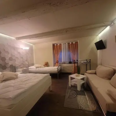 Ein Bett oder Betten in einem Zimmer der Unterkunft Pension - Ferienwohnung K&M