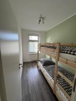 Ein Bett oder Betten in einem Zimmer der Unterkunft Stadtnahe 3-Schlafzimmer-Wohnung