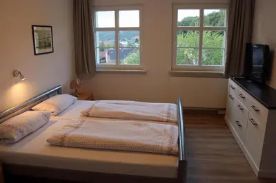 Ein Bett oder Betten in einem Zimmer der Unterkunft Ferienwohnung im Kasperhaus