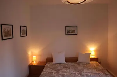 Ein Bett oder Betten in einem Zimmer der Unterkunft Ferienwohnung im Kasperhaus