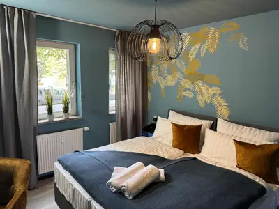 Ein Bett oder Betten in einem Zimmer der Unterkunft Ankommen & wohlfühlen - Ihr stilvolles Zuhause