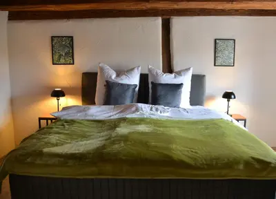 Ein Bett oder Betten in einem Zimmer der Unterkunft Ferienhaus mit 2 Schlafzimmern in Grimma nahe Mulderadweg