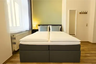 Ein Bett oder Betten in einem Zimmer der Unterkunft LUMA Apartments