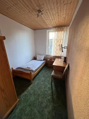 Ein Bett oder Betten in einem Zimmer der Unterkunft Gästehaus Trompeter
