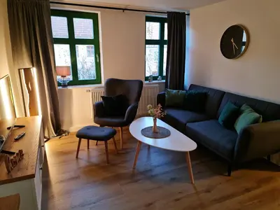 Ein Sitzbereich in der Unterkunft Apartment Marktplatz