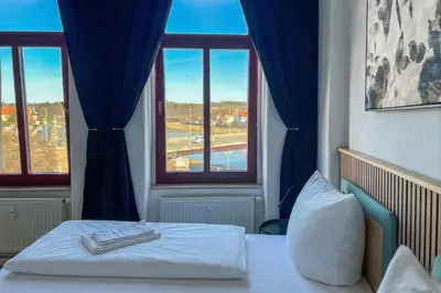 Ein Bett oder Betten in einem Zimmer der Unterkunft Homely Apartments Burgblick Parkplatz Wlan Küche Zentral