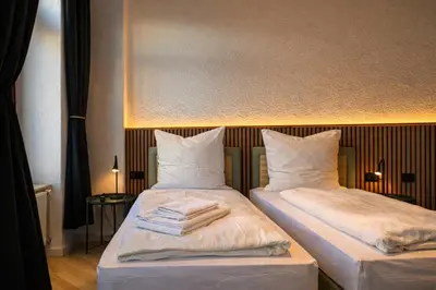 Ein Bett oder Betten in einem Zimmer der Unterkunft Homely Apartments Burgblick Parkplatz Wlan Küche Zentral