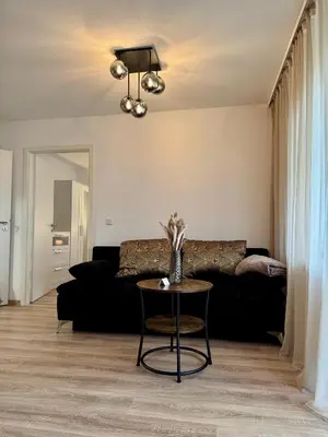 Ein Sitzbereich in der Unterkunft Modernes 2-Zi Apartment mit Terrasse und Garten