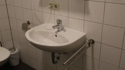 Ein Badezimmer in der Unterkunft Hotel an der Rennbahn Kostenloses Parken