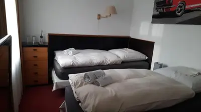 Ein Bett oder Betten in einem Zimmer der Unterkunft Hotel an der Rennbahn Kostenloses Parken