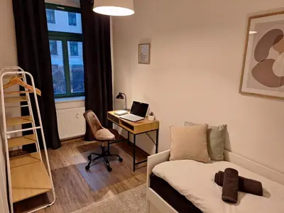 Ein Bett oder Betten in einem Zimmer der Unterkunft Ehrwürdig wohnen am hinteren Kassberg