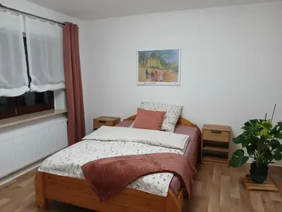 Ein Bett oder Betten in einem Zimmer der Unterkunft Ferienwohnung Waldwinkel