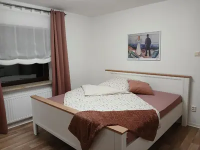 Ein Bett oder Betten in einem Zimmer der Unterkunft Ferienwohnung Waldwinkel