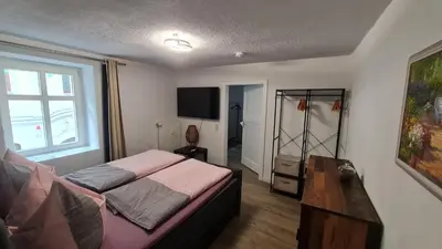 Ein Bett oder Betten in einem Zimmer der Unterkunft Ferienwohnung Hugos Altstadt