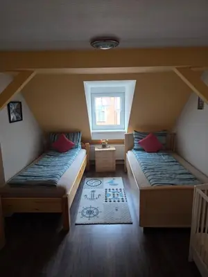 Ein Bett oder Betten in einem Zimmer der Unterkunft Flonta Ferienwohnung