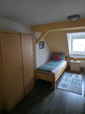 Ein Bett oder Betten in einem Zimmer der Unterkunft Flonta Ferienwohnung