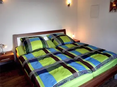 Ein Bett oder Betten in einem Zimmer der Unterkunft Apartment Schöne Ferienwohnung mit Garten und Grill by Interhome