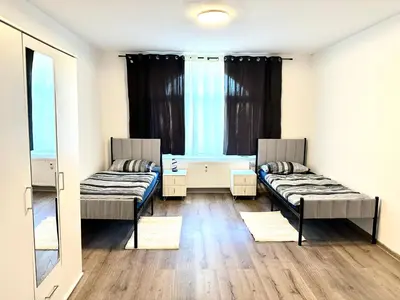 Ein Bett oder Betten in einem Zimmer der Unterkunft Aparthotel mit Balkon
