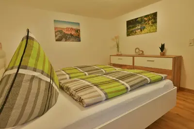 Ein Bett oder Betten in einem Zimmer der Unterkunft Ferienwohnung Wanderlust