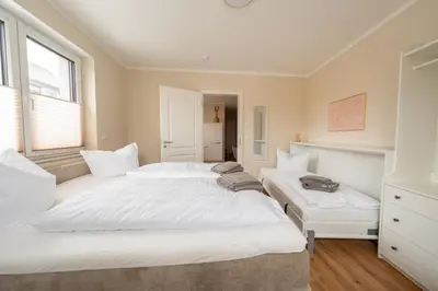 Ein Bett oder Betten in einem Zimmer der Unterkunft Haus Lindolino