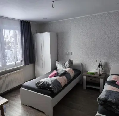 Ein Bett oder Betten in einem Zimmer der Unterkunft Gästehaus Müller