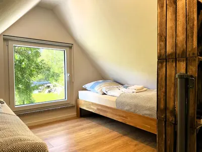 Ein Bett oder Betten in einem Zimmer der Unterkunft Hoffmannshof