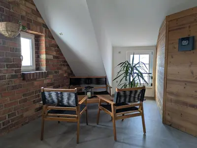 Ein Sitzbereich in der Unterkunft Rotes Nest