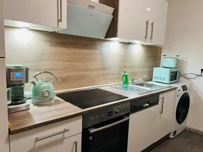 Küche/Küchenzeile in der Unterkunft Moderne Ferienwohnung im Stadtzentrum - ClaraNest