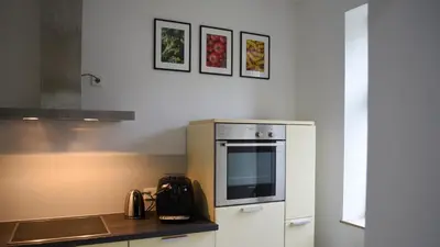 Küche/Küchenzeile in der Unterkunft Moderne 2-Zimmer-Wohnung mit WLAN & Smart-Home