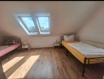 Ein Bett oder Betten in einem Zimmer der Unterkunft Ferienwohnung Witzschdorfer Höhe