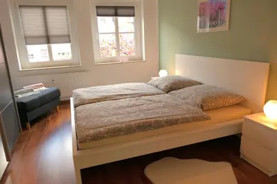 Ein Bett oder Betten in einem Zimmer der Unterkunft Apartment Kirschblüte mit Balkon