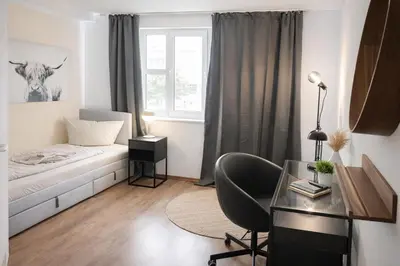 Ein Bett oder Betten in einem Zimmer der Unterkunft Aparthotel MY HOME Chemnitz-Limbach