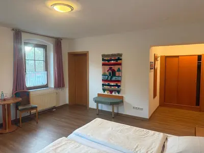 Ein Bett oder Betten in einem Zimmer der Unterkunft Eutschützer Mühle