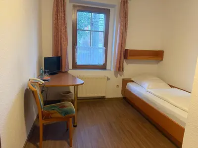 Ein Bett oder Betten in einem Zimmer der Unterkunft Eutschützer Mühle