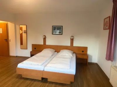 Ein Bett oder Betten in einem Zimmer der Unterkunft Eutschützer Mühle