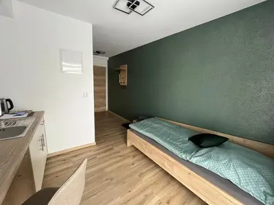 Ein Bett oder Betten in einem Zimmer der Unterkunft Apartment Zum Schlosspark Lauchhammer