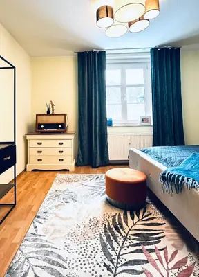 Ein Bett oder Betten in einem Zimmer der Unterkunft KÜCHWALDBLICK Designsuite