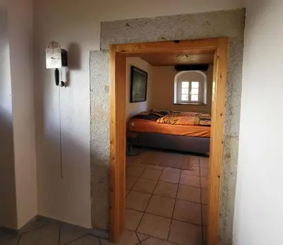 Ein Bett oder Betten in einem Zimmer der Unterkunft Ferienwohnung im Fachwerkhaus Maxen