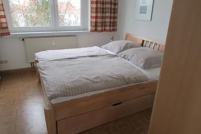 Ein Bett oder Betten in einem Zimmer der Unterkunft Ferienwohnung Schütze