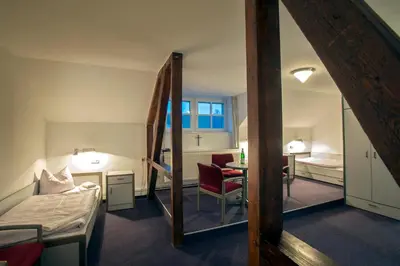 Ein Bett oder Betten in einem Zimmer der Unterkunft Bildungsgut Schmochtitz