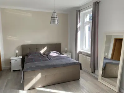 Ein Bett oder Betten in einem Zimmer der Unterkunft Apartmenthaus Zentral Bad Schandau
