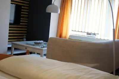 Ein Bett oder Betten in einem Zimmer der Unterkunft Gästehaus Stadtschaenke