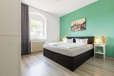 Ein Bett oder Betten in einem Zimmer der Unterkunft Schloß Sonnenstein